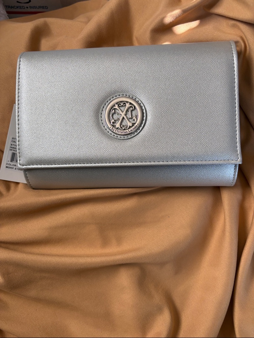 NWT- Christian Lacroix Metallic Silver Clutch with Logo Medallion